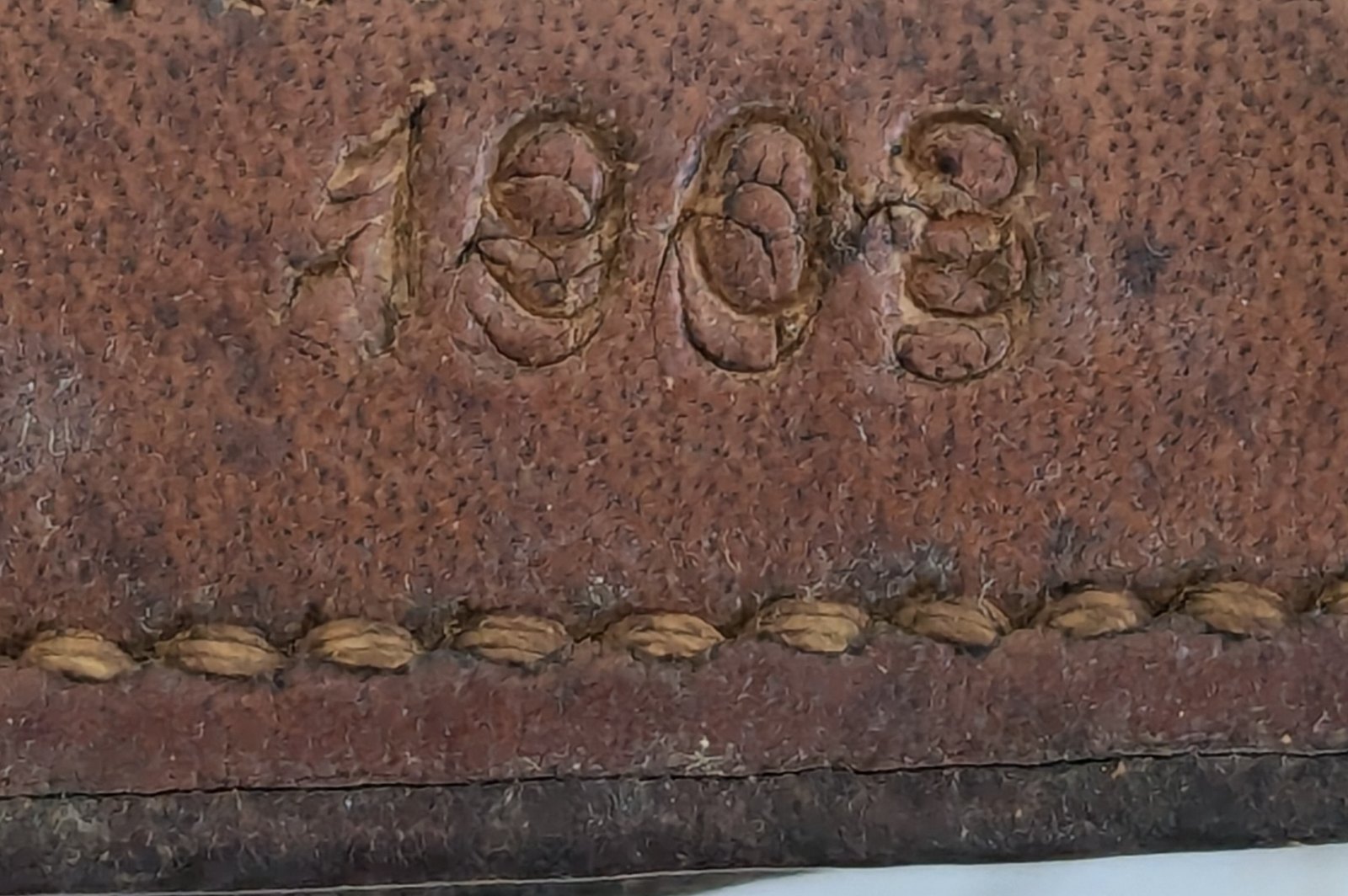 The year 1903 stamped into brown leather, Mystery Lot Hint #2
